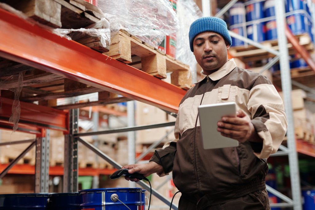 A man checking inventory in a warehouse
