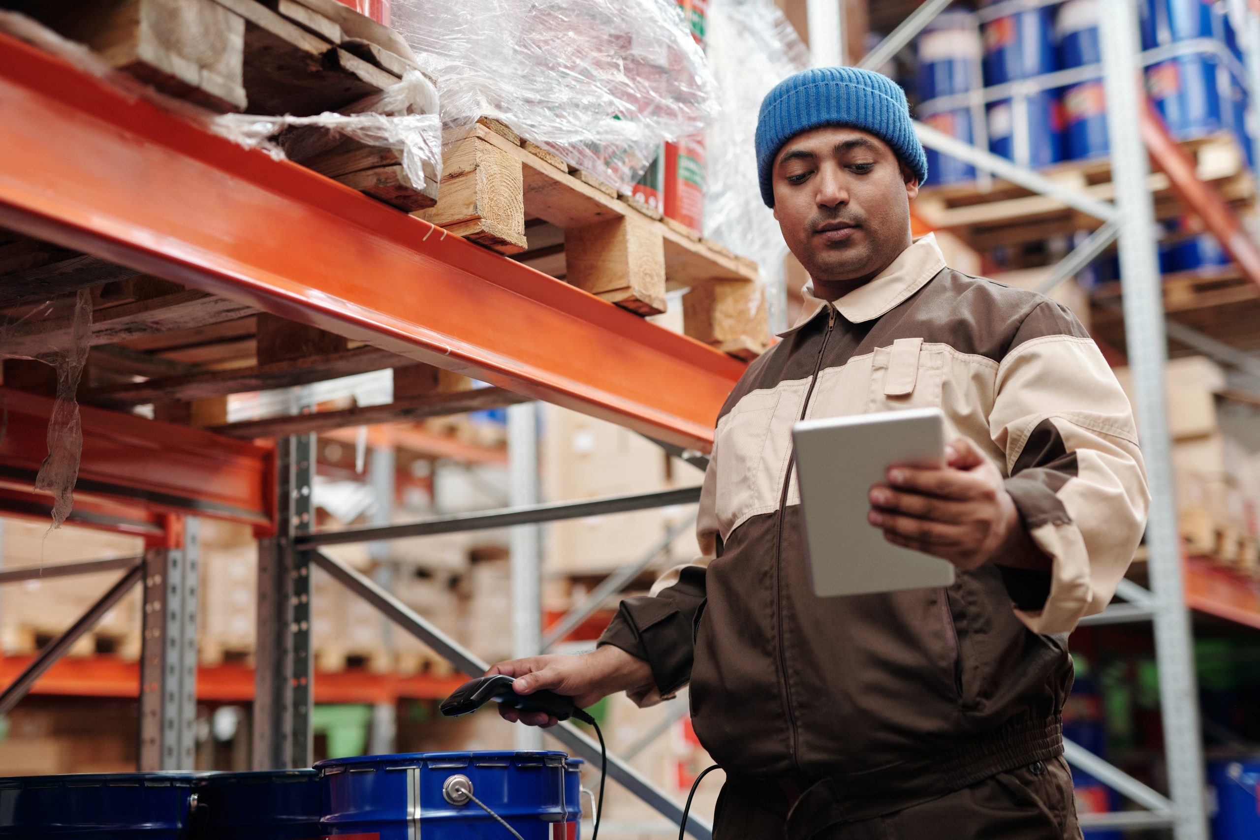 A man checking inventory in a warehouse
